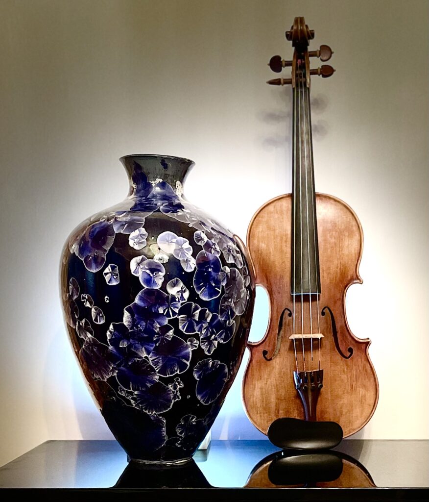vase next to a violin